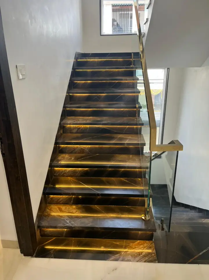Staircase with backlit stone treads