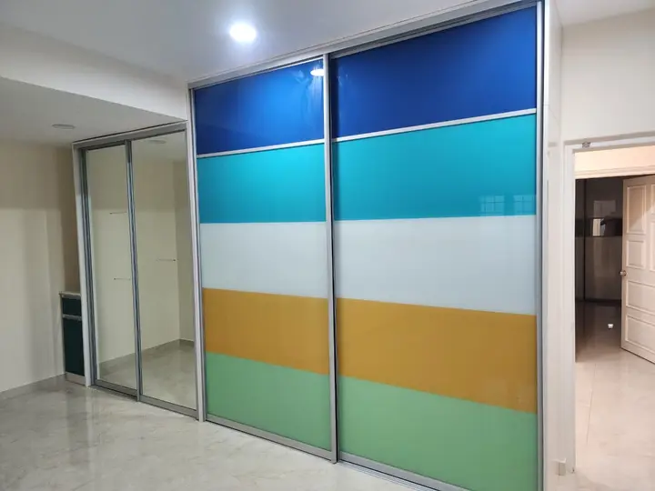 Wardrobe doors in blue, teal, yellow and green colour blocks