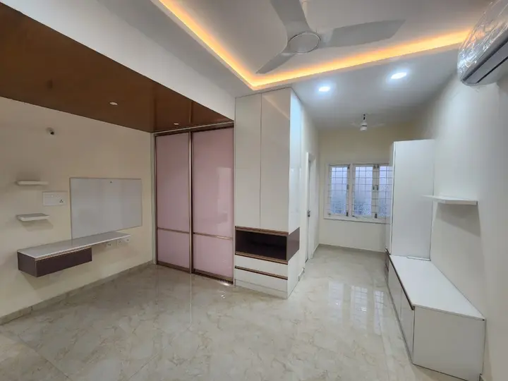 Bedroom with pink wardrobes and a timber ceiling drop
