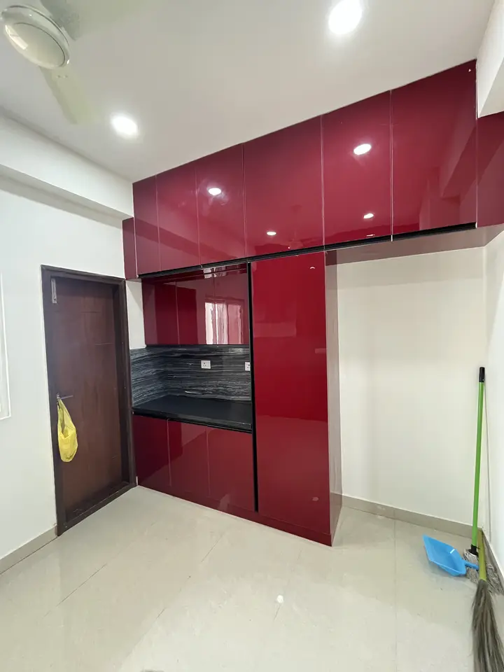 Red glossy wardrobe and kitchen units
