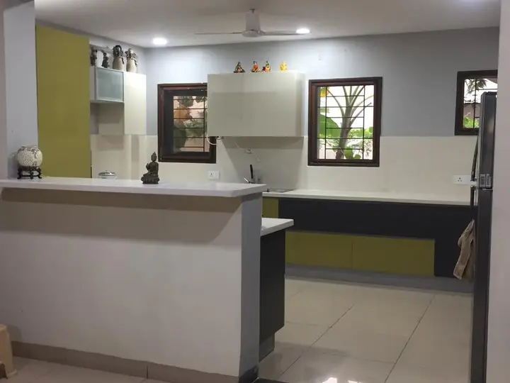 Kitchen with olive green and charcoal cabinets