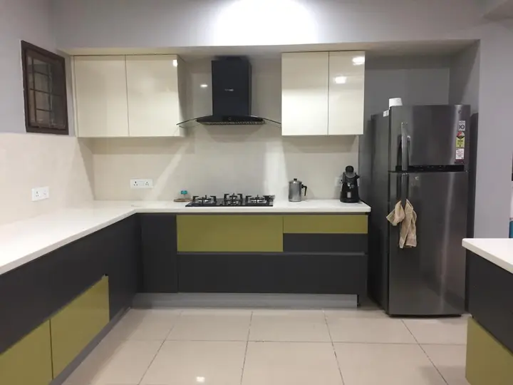 L-shaped kitchen in olive green and charcoal