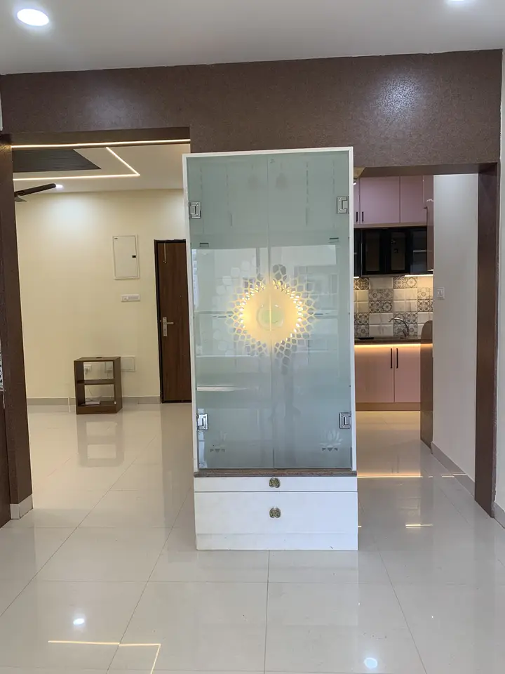 Glass partition with a round backlit feature at the entrance