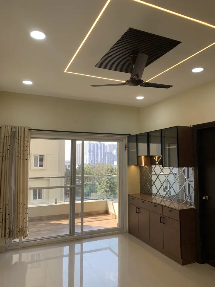 Glass partition and balcony doors beside a timber console