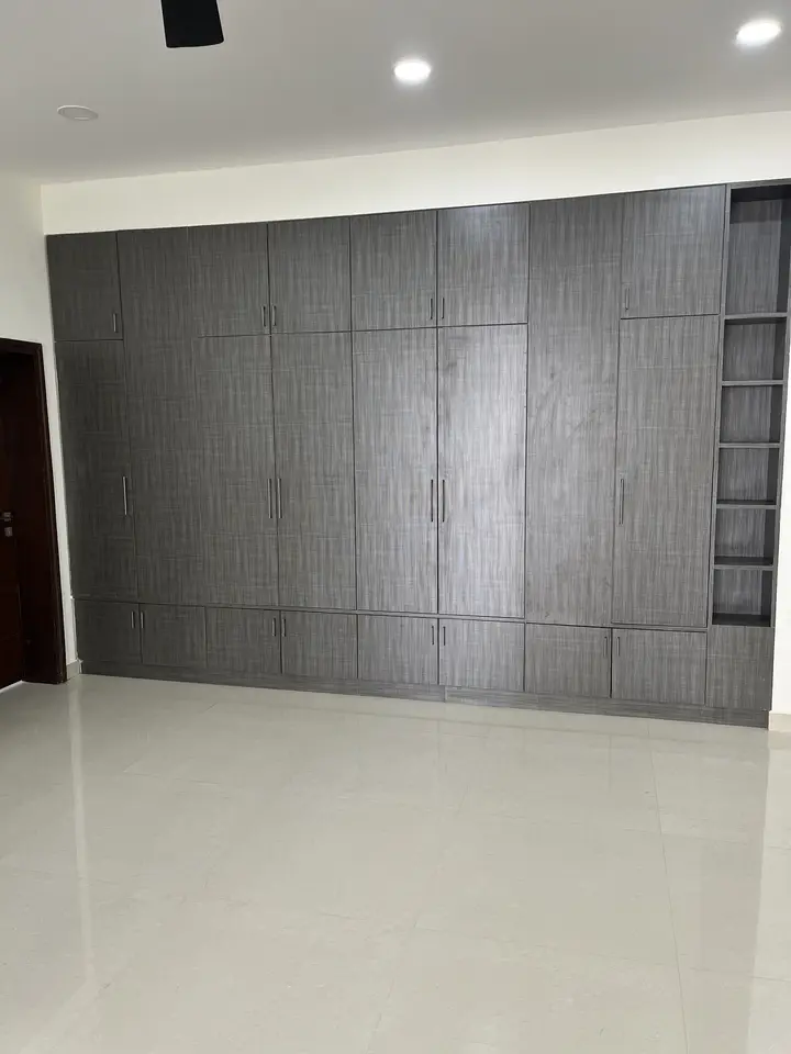 Floor-to-ceiling charcoal wardrobe