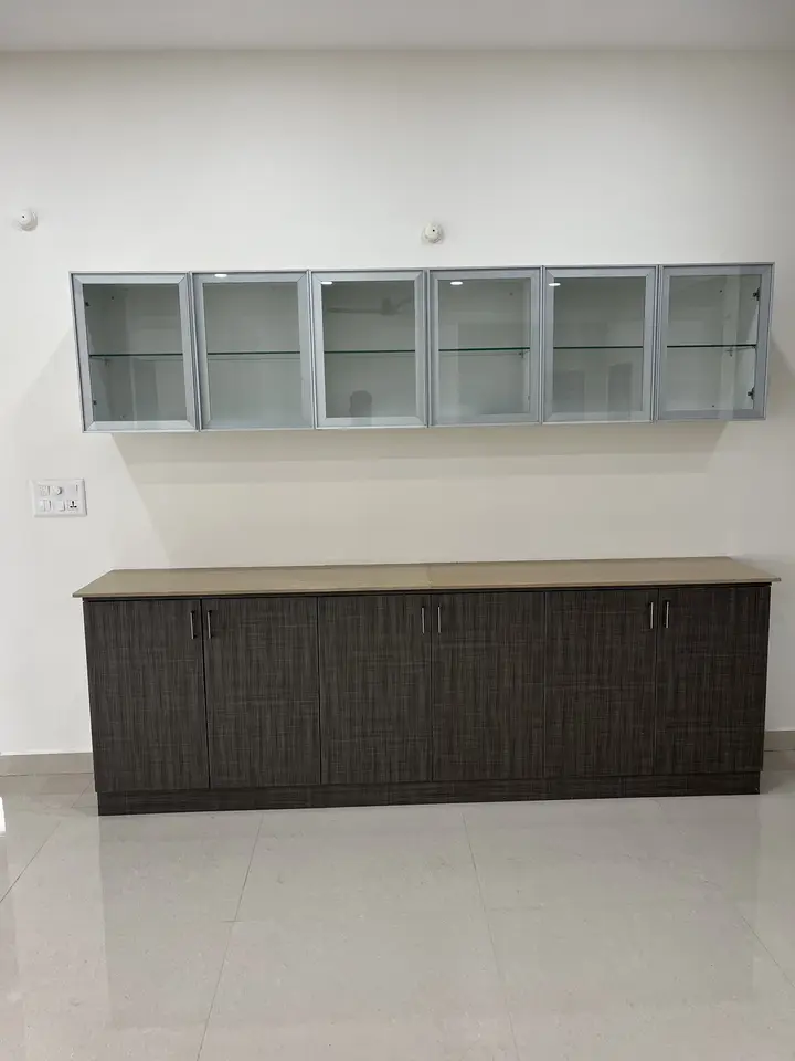 Charcoal crockery unit with glass-fronted white shutters