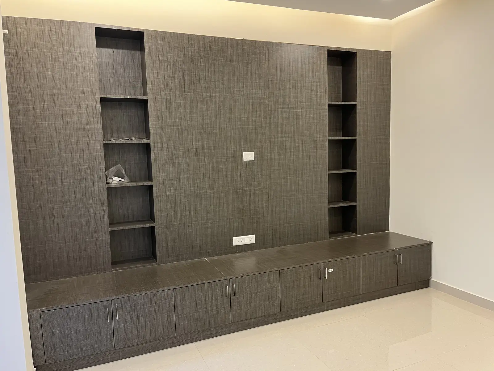 Charcoal TV wall with open shelves