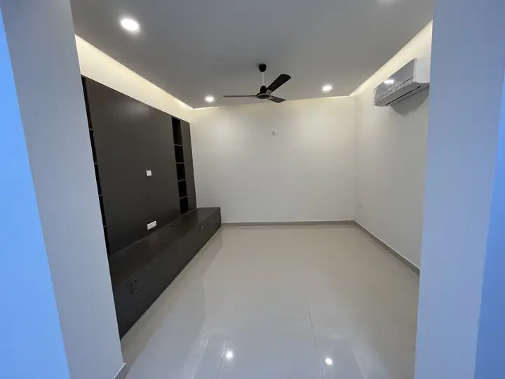 Bedroom with a dark panelled TV wall