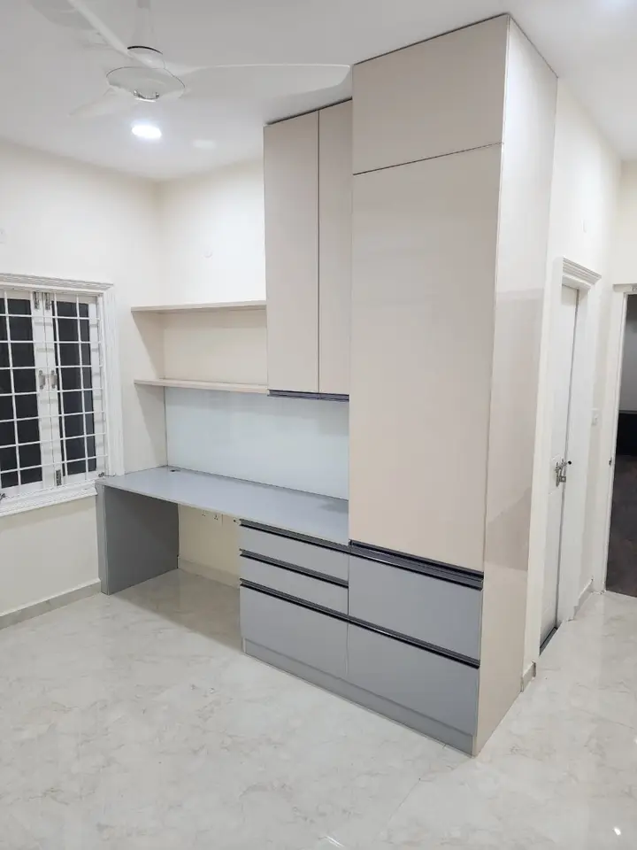 White and grey storage wall with a built-in desk