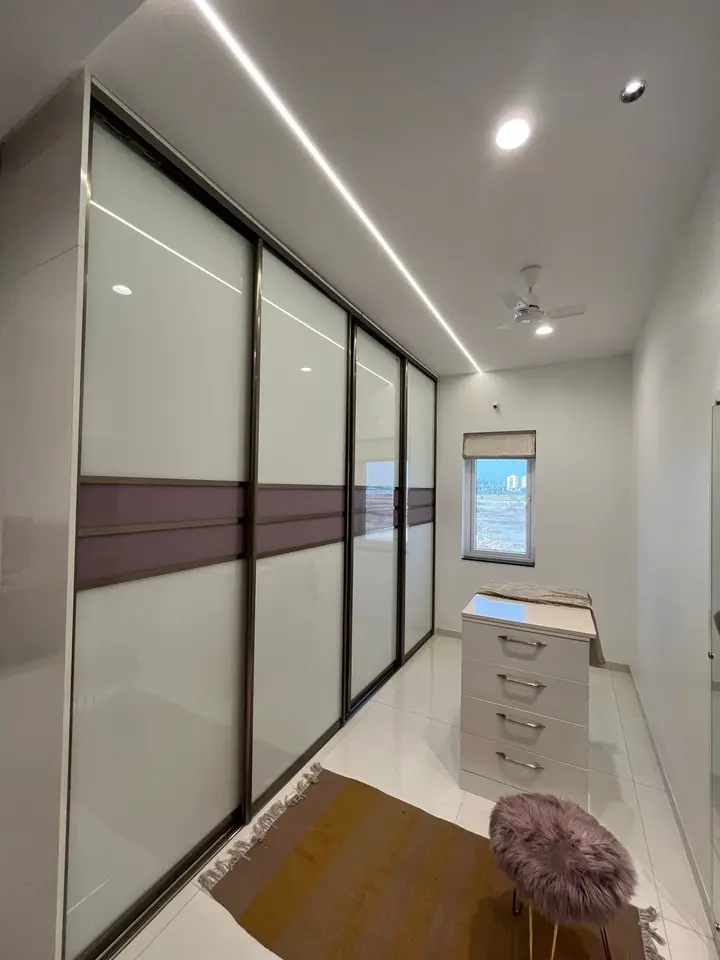 Sliding wardrobe with a brown glass band