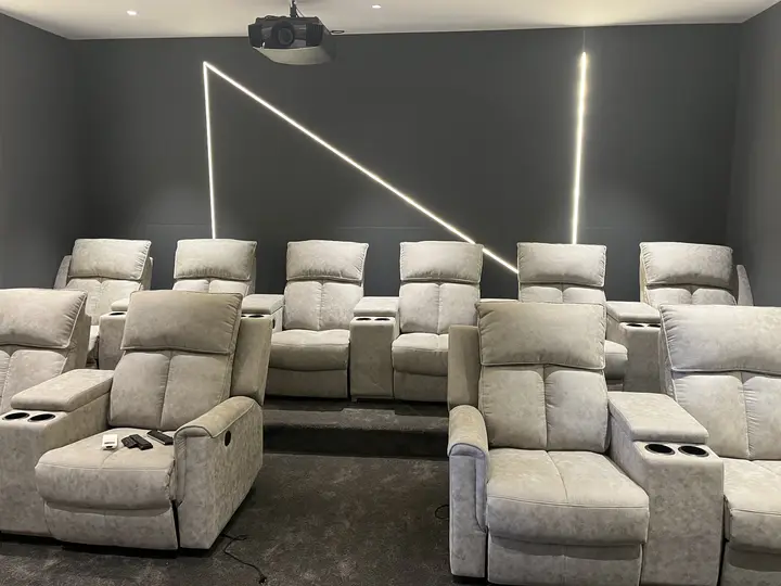 Tiered recliners under diagonal light lines