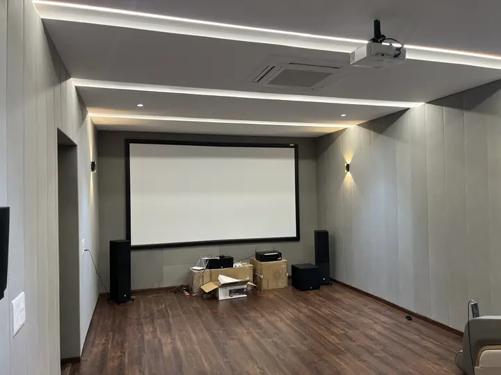 Home theatre with a timber floor and a recessed projection screen