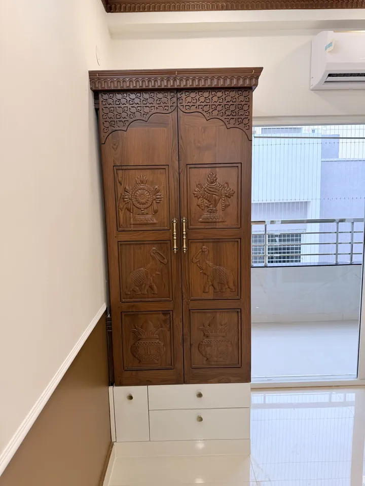 Timber wardrobe beside a bedroom window