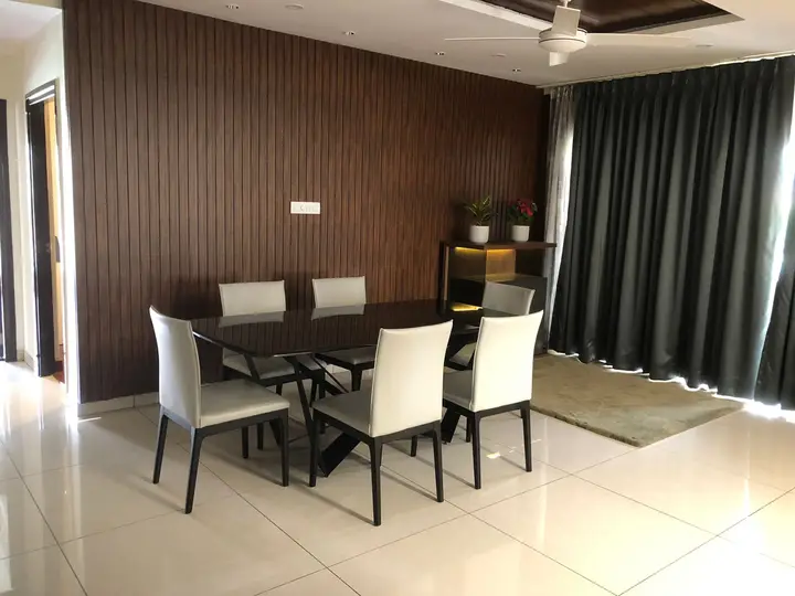 Dining table set in front of a walnut-panelled wall