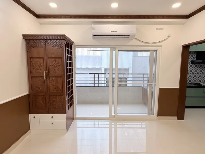 Bedroom with timber wardrobe and balcony doors