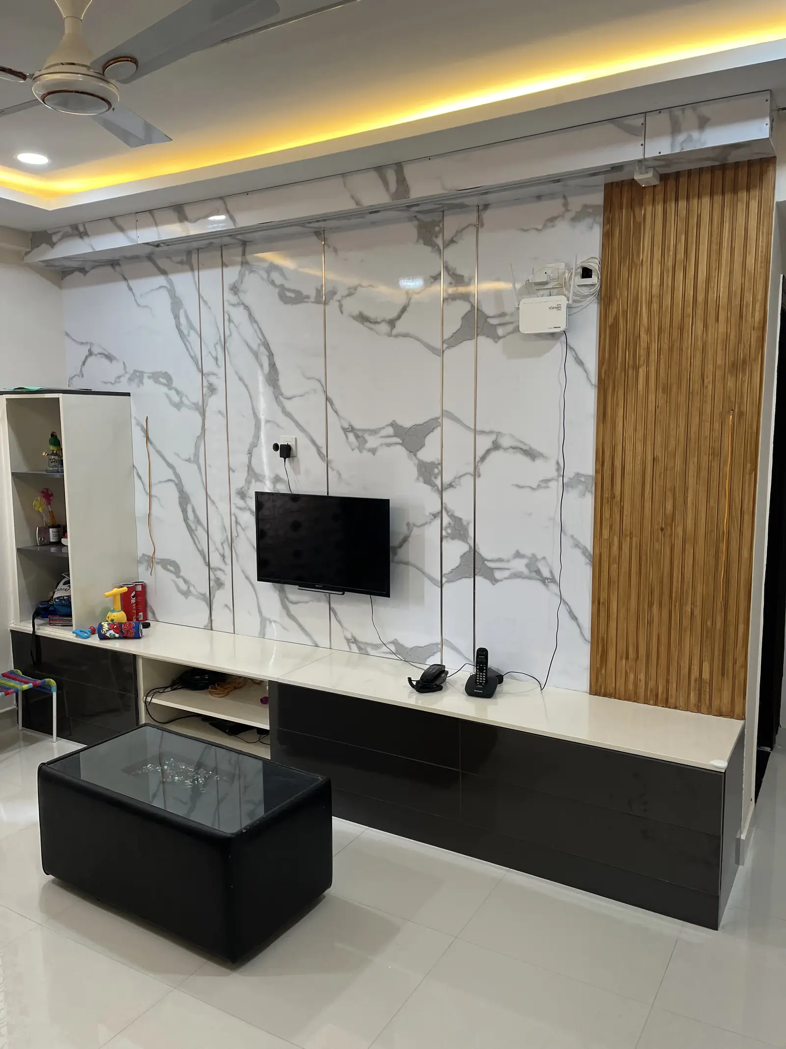 Marble TV wall with timber slat detail