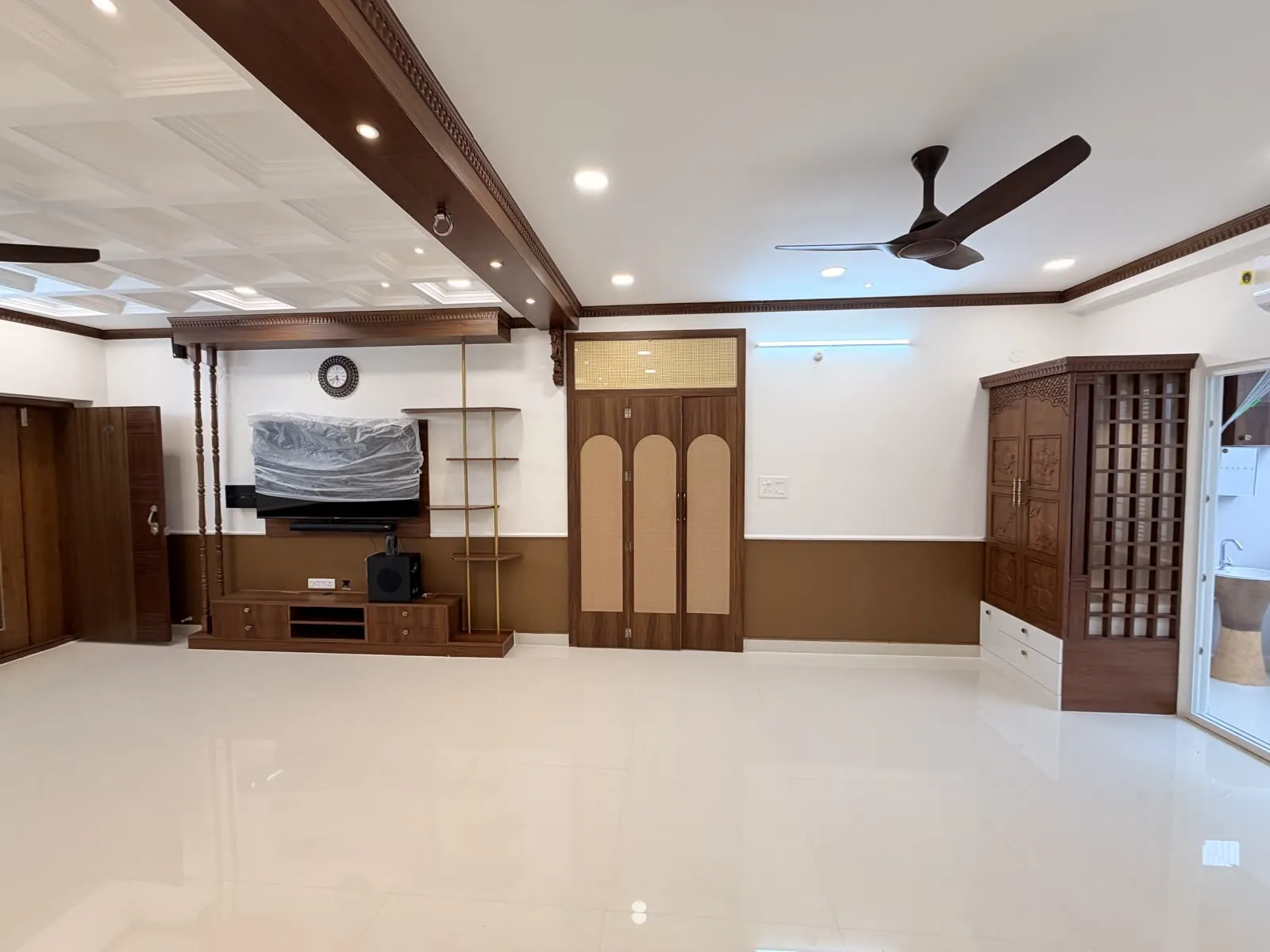 Living room with timber TV cabinetry and ceiling detail