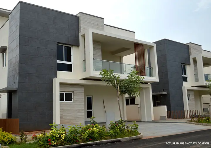 Villa with a grey stone and white render facade