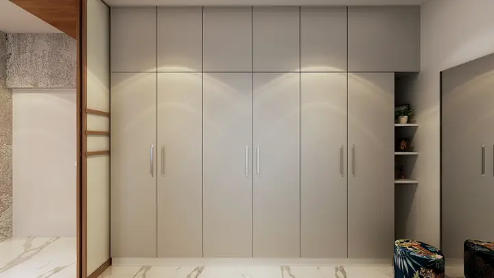 Cream wardrobe wall with tall panelled doors