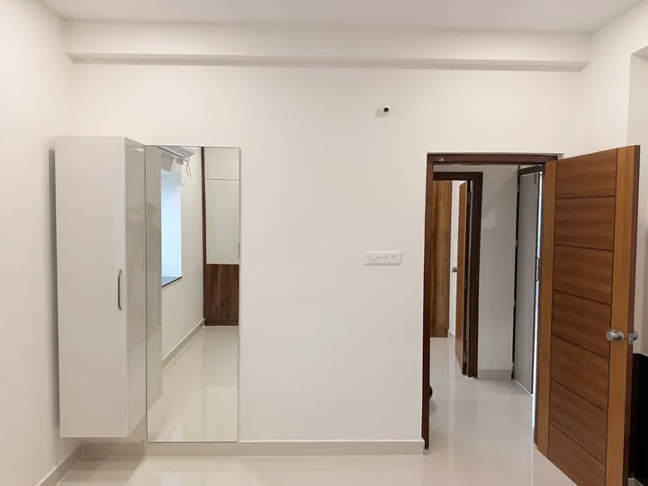 Hallway with built-in storage and a timber door