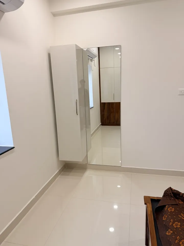 Narrow hallway with a full-height storage unit