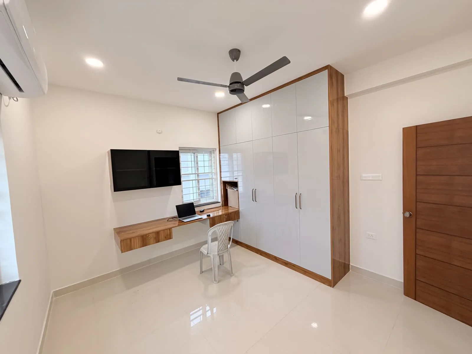 Dining area and living room with white built-in cabinetry