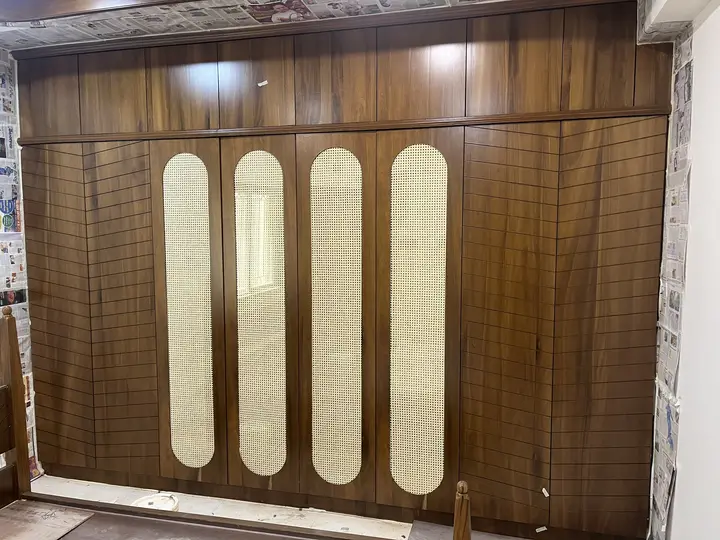 Walnut wardrobe with arched cane inlay panels