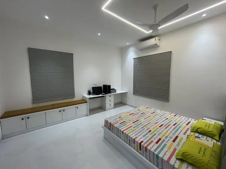 Bedroom with a window seat and built-in storage