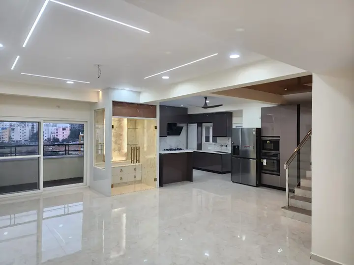 Open-plan ground floor with kitchen, stairs and glazed doors